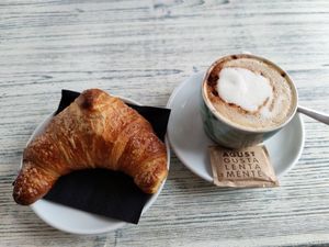 Nougat croissant and soy cappuccino at Feliz Cafe in Peschiera Del Garda