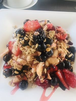 Breakfast pancakes with muesli and fresh fruit  at Feliz Cafe in Peschiera Del Garda