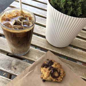 Oatly iced latte and an oat cookie at Flora and Fauna in Fremantle