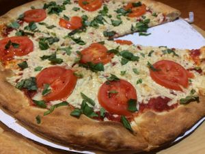Large pizza with tomato garlic and basil at Red Brick Pizza in Las Cruces