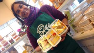 the owner with new products at Vegan Store Stall 83 in Rome