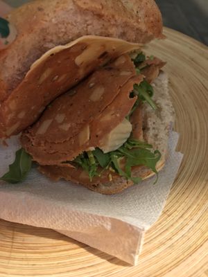 Vegan panino with vegan mortadella and chickpea cheese at Vegan Store Stall 83 in Rome