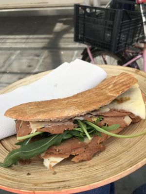 Vegan panino on reusable plate at Vegan Store Stall 83 in Rome