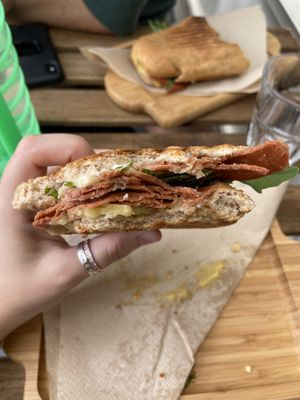 Panini with vegan salami, & vegan emmental & Parmesan with rocket & mustard. Spectacular! at Vegan Store Stall 83 in Rome