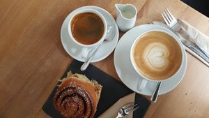Vegan cinnamon roll. Soy latte at Dots Cafe in Berlin