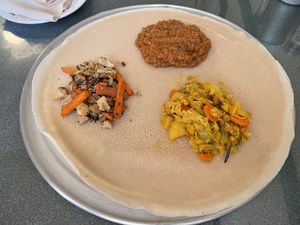 Yemisir Kay Wat - red lentils, sauteed with onions in a spicy berbere sauce; Gomen Alicha  — carrots, cabbage & potatoes simmered in mild turmeric-based sauce; and cauliflower.  at Zemam's in Tucson
