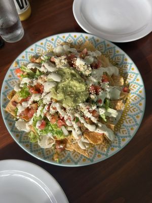 Loaded Nachos with lots of guacamole, refried beans and cashew sour cream   at Organico Fortuna in La Fortuna