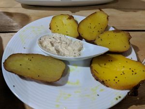 side of potatoes with surprise macademia "cheese" at Organico Fortuna in La Fortuna