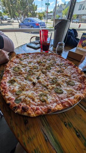 Large - vegan cheese, jalapeno, garlic, and caramelized onions at Red Tractor Pizza in Bozeman