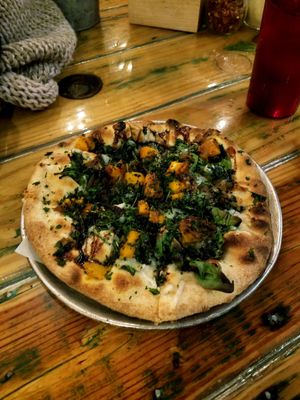 Yummy squash & kale with daiya! at Red Tractor Pizza in Bozeman