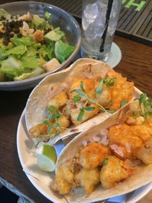 Caesar salad and Buffalo cauliflower tacos at Bar Bombon in Philadelphia