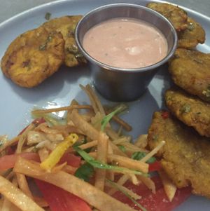 Tostones with aioli and tomato salad at Bar Bombon in Philadelphia