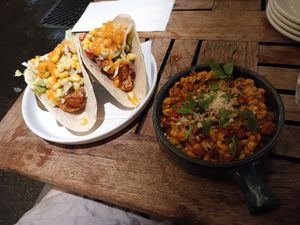 Mock fish tacos with hearts of palm and Mexican street corn on the side. at Bar Bombon in Philadelphia
