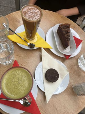 Cookie, cake, matcha latte and cacao latte  at bistRAW & Tea in Prague