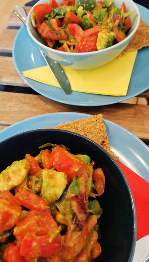 fresh salad with tomato and avocado at bistRAW & Tea in Prague