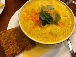 Very delicious raw warm carrot soup with crackers  at bistRAW & Tea in Prague