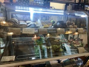 Daily cake and sandwich selection at bistRAW & Tea in Prague