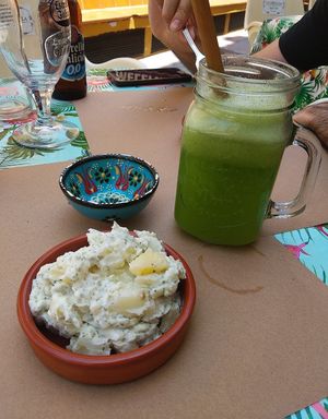 Papas alioli y zumo at La Libelula Vegan Cafe in Fuengirola