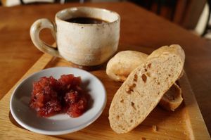 A breakfast at en.gawa: toasted homemade bread with homemade low-sugar strawberry jam and coffee served in a locally made rustic mug (can potentially be purchased at nearby pottery works). at En.Gawa in Tsu