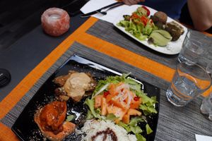 Tempeh dish, and in the back is a falafel dish at La Libellula Ristorante Bistrot in Udine