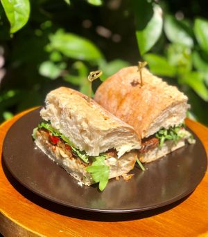  Italian sub - Smoked tempeh, mozzarella cheese, roasted peppers caponata, pickles & fresh basil

#ItalianSub #LunchMenu
#FullBloomVegan
#GourmetVeganCuisine
#nutfree #vegan at Full Bloom in Miami Beach