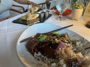 seitan/potato dish in front and vegan burger in back (friend was not impressed with the burger)  at Full Bloom in Miami Beach
