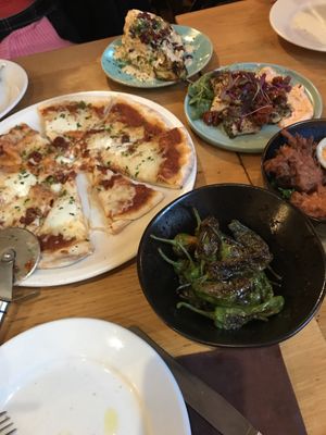 pizza and chicken not vegan- padron peppers, hispi cabbage, sweet potato fritters, patatas bravas  at Under the Stars  in Bristol