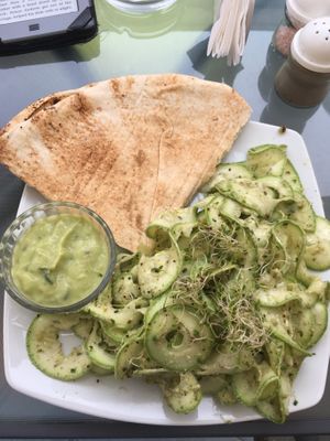 Raw courgette with pesto and a side of pita at BIOFresh in Timisoara