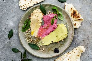  3 hummuses - traditional, beetroot, avocado with warm tortilla at Cafe Kulturalna in Warsaw