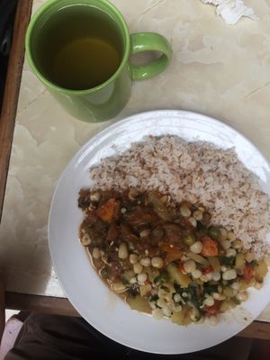 Tea and main plate with mixed veggies, "meaty" celery, and barley rice.  at Comedor Vegetariano in Huaraz