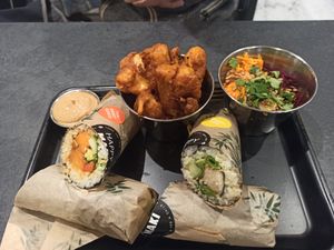 Double up on the sushi rolls, added cauliflower popcorn, plus rainbow salad at Happy Maki in Brighton
