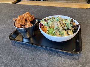 Popcorn cauliflower with satay sauce and salmon with a kick sushi bowl  at Happy Maki in Brighton