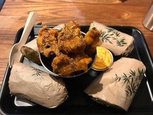 Popcorn cauliflower with spiced coconut sauce  at Happy Maki in Brighton