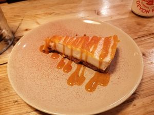 Lemon cheesecake with mango coulis at Purezza in Brighton