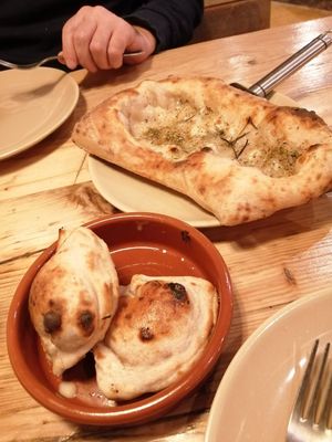 Garlic bread and doughballs with cheese, the cheese is gooey and delicious at Purezza in Brighton
