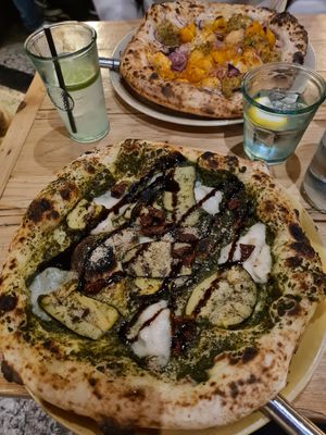 Pesto pizza in the front and tuna pizza in the back at Purezza in Brighton