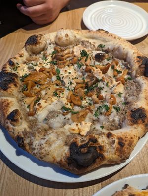 The best pizza I've ever had!! - with black truffle base, mushrooms, vegan camembert. at Purezza in Brighton