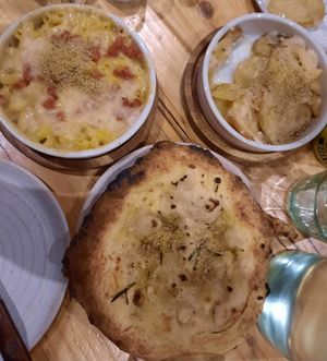 Mac & Cheese, Garlic Roast Potatoes, and Sourdough Garlic Bread at Purezza in Brighton