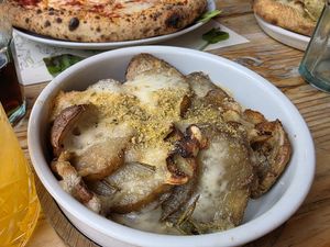 Cheesy garlic potatoes. at Purezza in Brighton