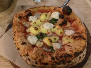 I don't remember what's the name of this pizza and I have no idea if it is still available. It was made using a few kinds of cheese. Delicious. at Purezza in Brighton