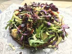 Raw Pizza! Very delicious just the bottom is pretty hard to slice. at Purezza in Brighton