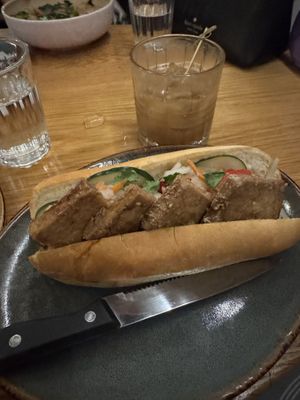 Bahn mi and Black Gold cocktail  at Doi Moi in Washington
