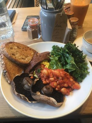 Yesterday’s breakfast. Seitan, scrambled tofu, beans, mushrooms, avo and kale. Sourdough on the side. So good! Love this place xxx at Chia Naturally Healthy in Hitchin