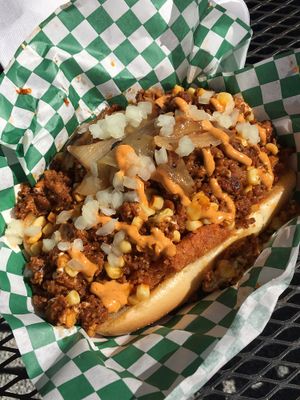 The trash dog: Soyrizo, crispy hash browns, caramelized onions, raw onion, chipotle vegan mayo, corn  at Cycle Dogs in Seattle
