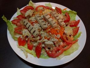 Enjoying the BEYOND CHICKEN bought at The Vegan Factory on my salad at The Vegan Factory in Playa Del Carmen