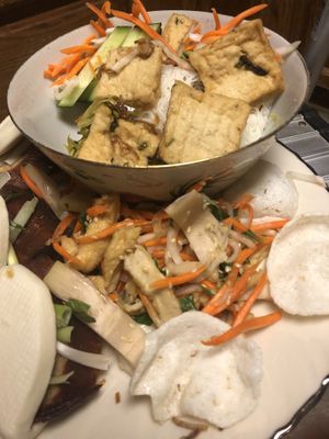 Steamed vermicelli with fried tofu in bowl with jackfruit salad below at Pho Vegan Asian Cuisine in Rocklin