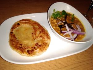 Chickpea curry with garlic roti (vegan)  at Veggo Sizzle in Adelaide