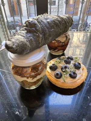 Carrot cake and tiramisu, mascarpone tarte and charcoal croissant  at La Besnéta in Barcelona