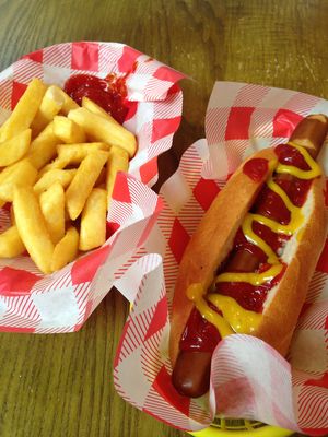 hot dog and a side of fries  at Vegan Hippo in London