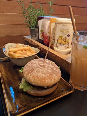 A veggie burger and fries, note all sauces are vegan at Hans im Glück - Isartorplatz in Munich